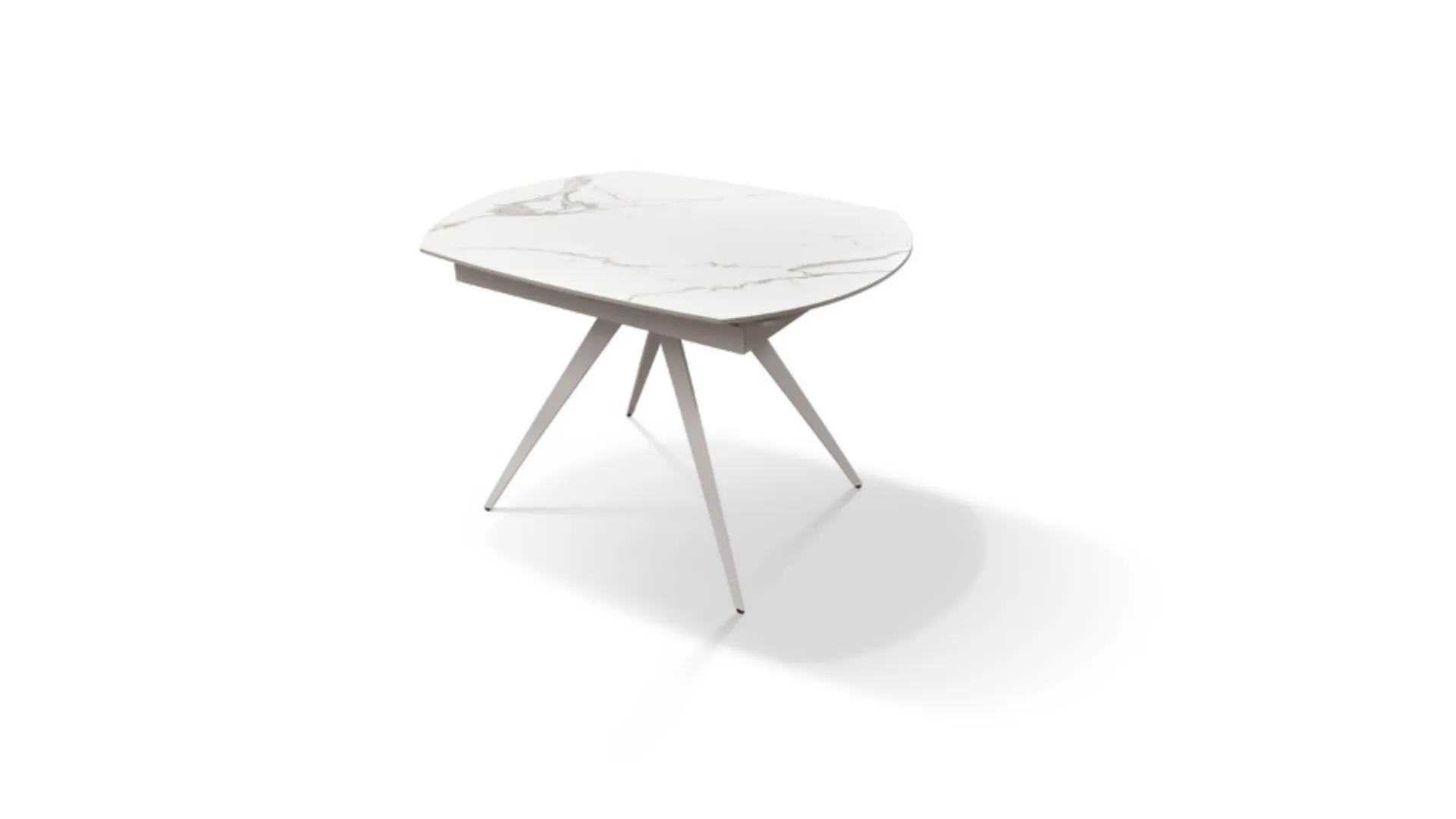 Extendable table with a shaped ceramic top and a central metal base with a white finish.