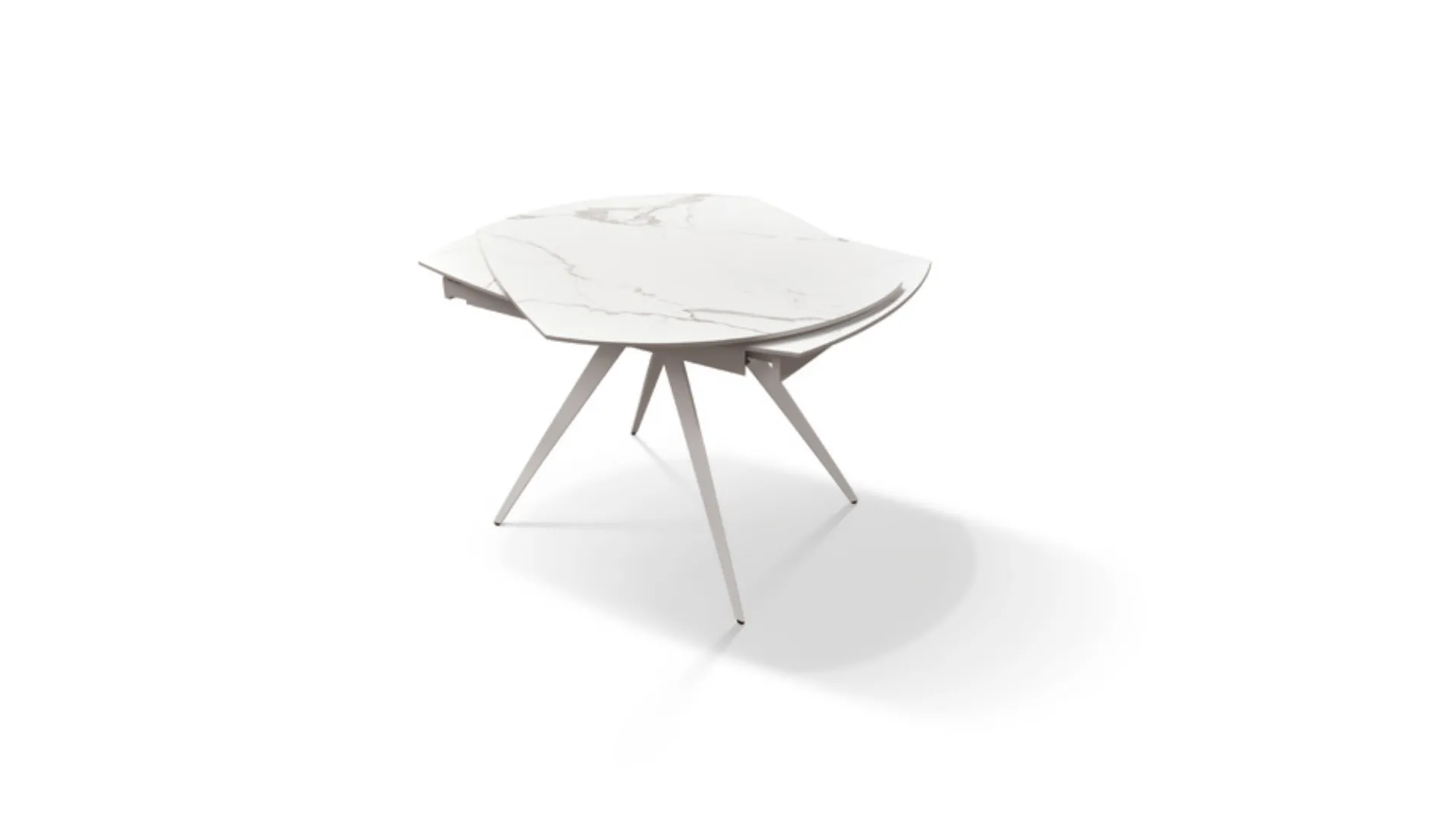 Extendable shaped table with ceramic top and central metal base with white finish.