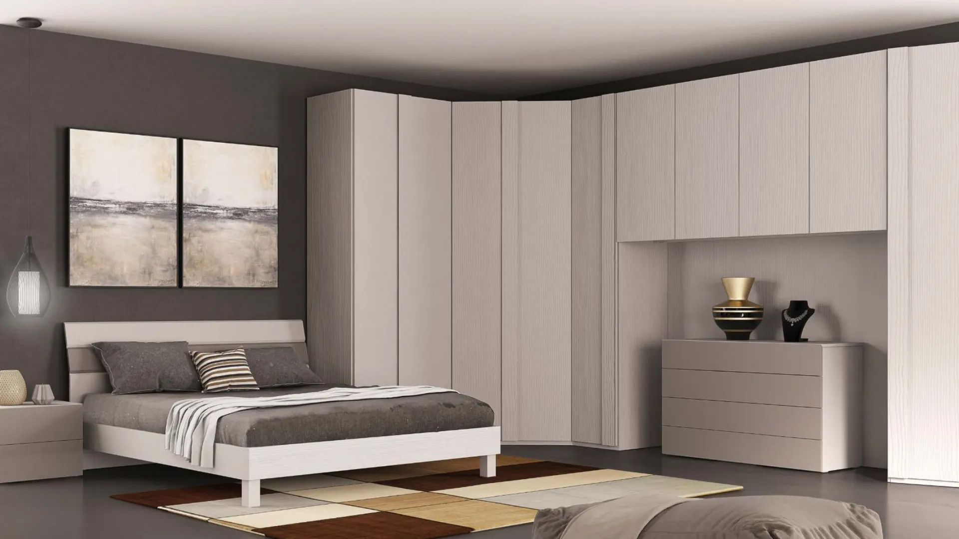 Double bedroom with spacious corner walk-in wardrobe, chest of drawers, bedside tables, and Nuvola bed.