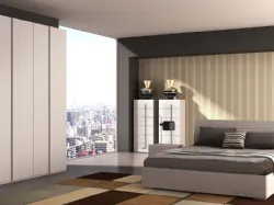 Modern double room with Bologna bed and matching elements in Larice Bianco finish.