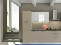 Smooth white laminate kitchen complete with Candy appliances