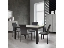 Extendable table with four metal legs, rustic oak top, and side extension.
